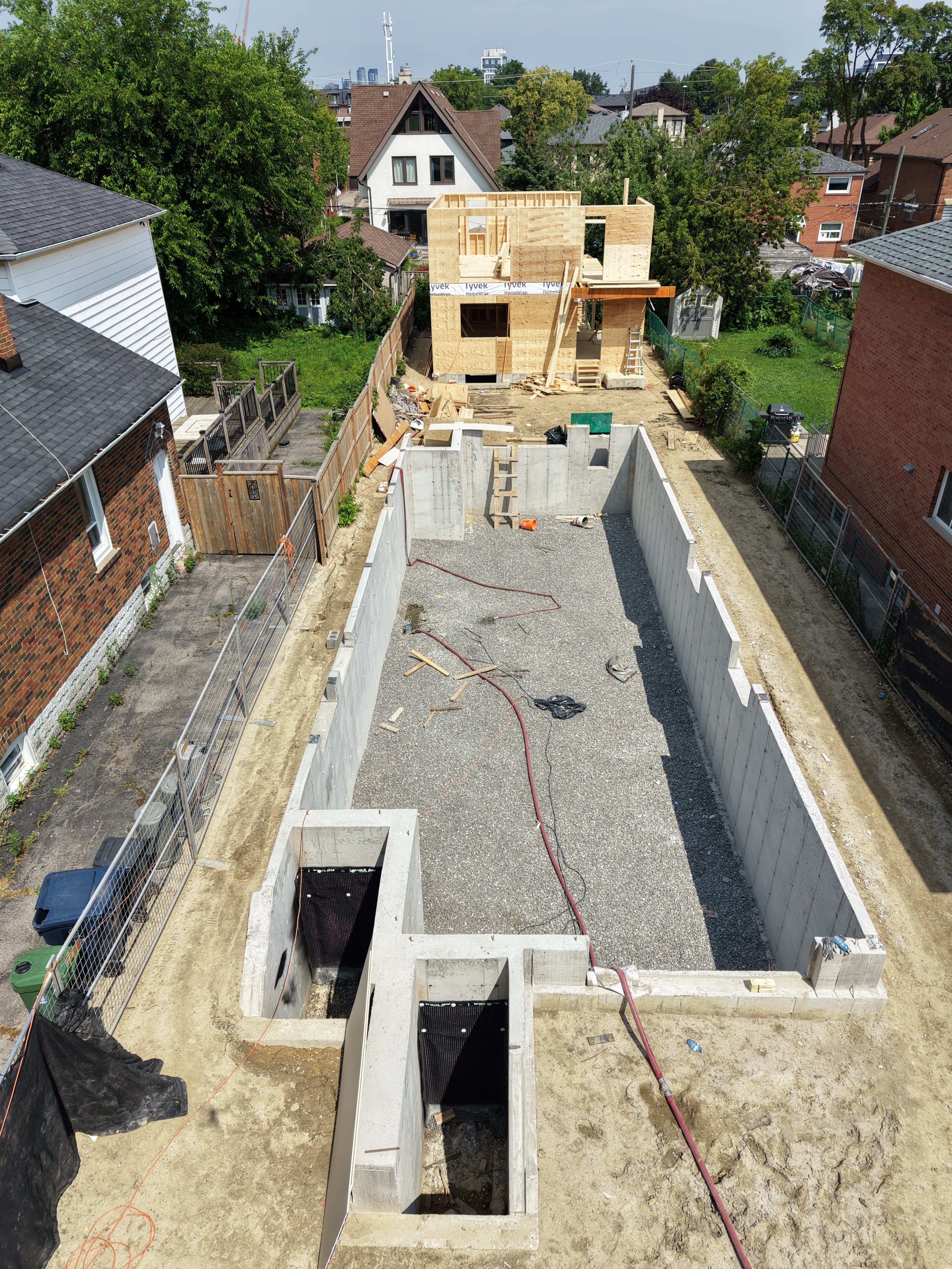Mimico 01 concrete foundation and framing progress, angle two